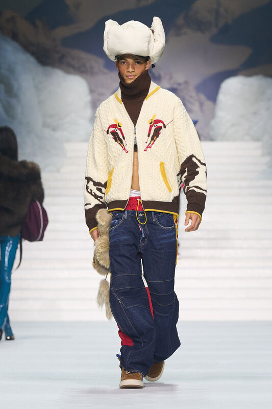 Уникальный свитер с ярким узором и объемные джинсы создают игривый и креативный стиль, подчеркивая индивидуальность