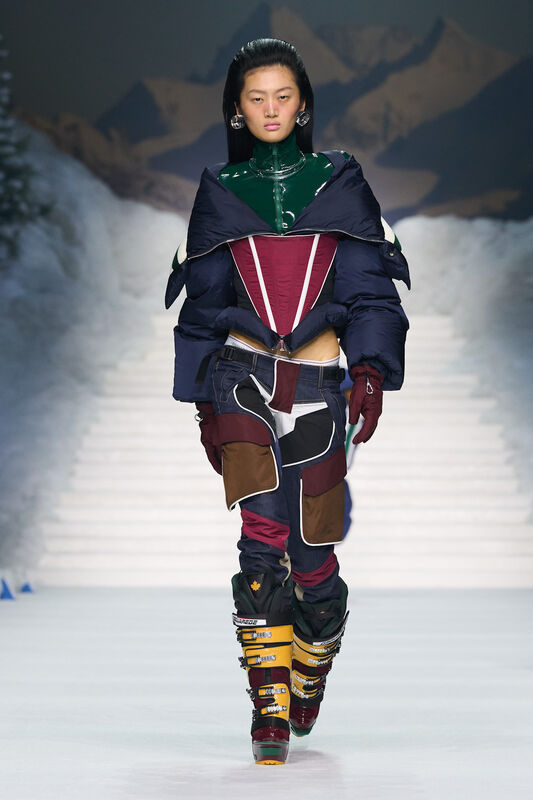 Модный наряд с яркими вставками и объемной курткой, акцент на необычные детали и высокие ботинки для горнолыжного стиля